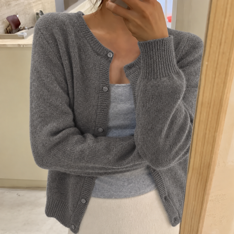 Women’s Bandalini soft knit cardigan with button front, round neckline, and relaxed fit, shown draped over a casual outfit.