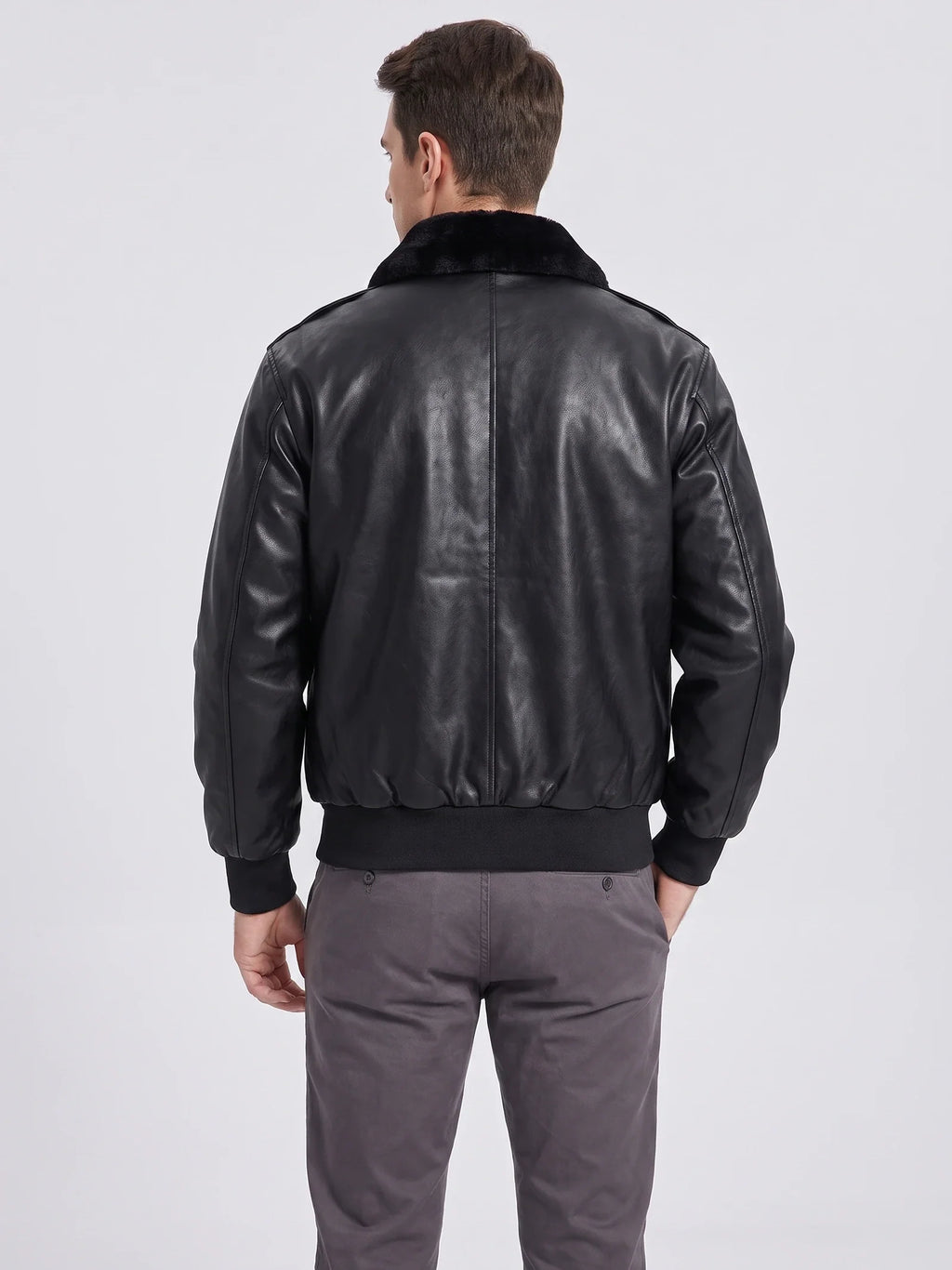 Men's black leather bomber jacket by Bandalini featuring padded A-2 style design for winter warmth, shown from the back.
