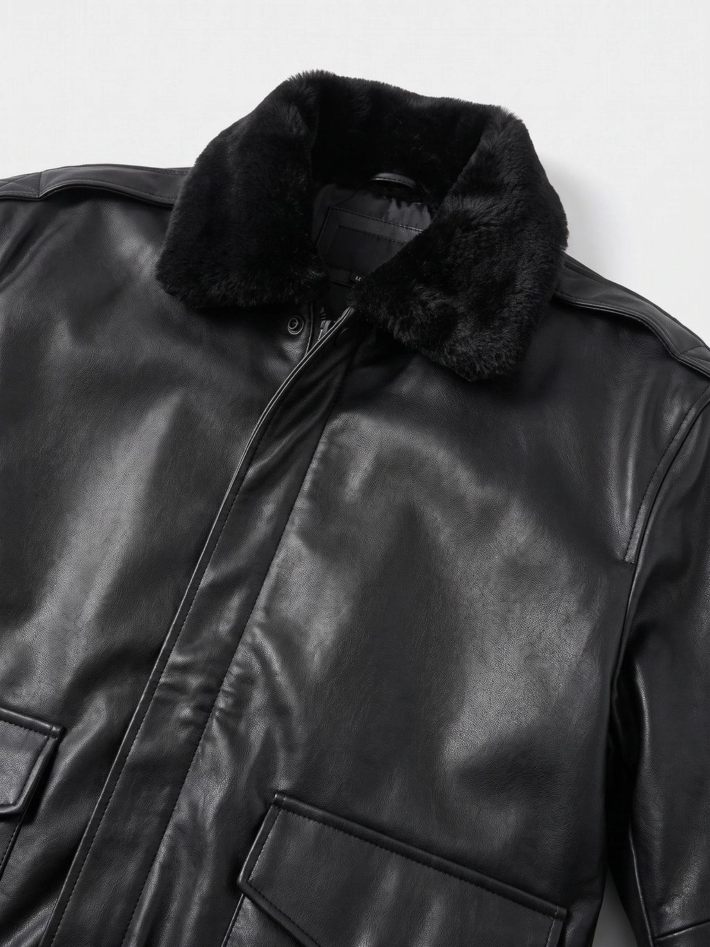 Men's black leather bomber jacket by Bandalini with padded A-2 style design, suitable for winter, featuring detailed black accents.