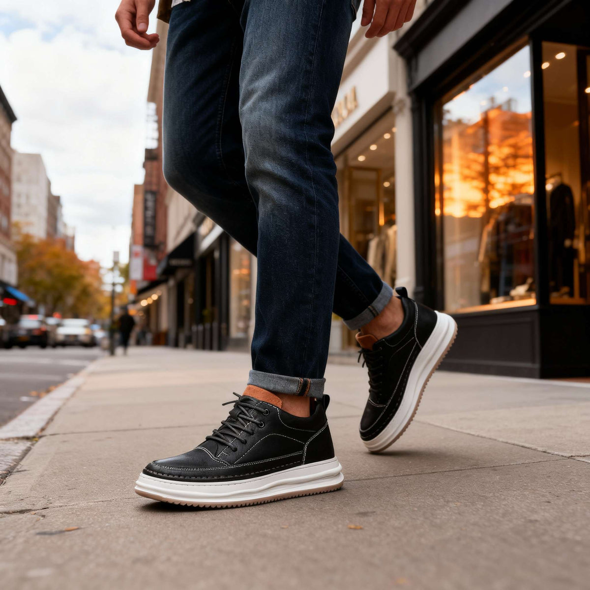 Men's textured leather casual sneakers with padded collar and cushioned insole, by Bandalini, shown on a city street.