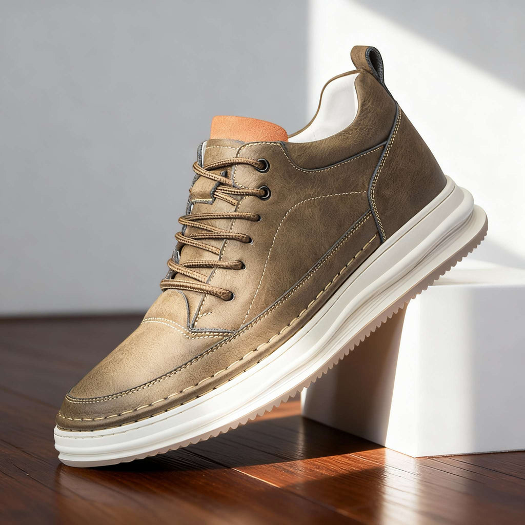 Men's textured leather casual sneakers by Bandalini with padded collar and cushioned insole on dark brown hardwood floor.
